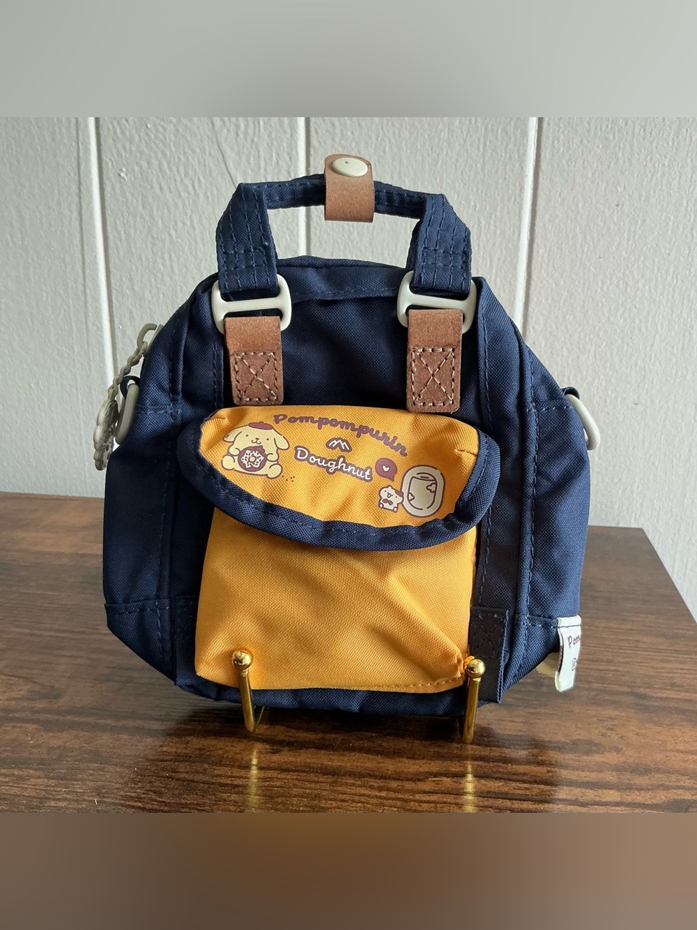 A rare out of stock Doughnut x Pompompurin Sanrio Macaroon Tiny crossbody bag